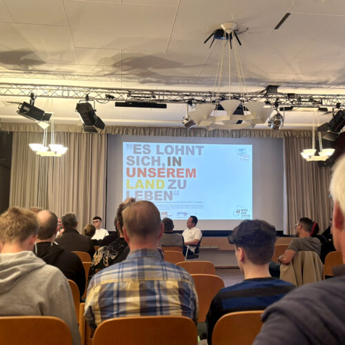 Publikum Septembergespräch 2025 mit Blick auf Leinwand